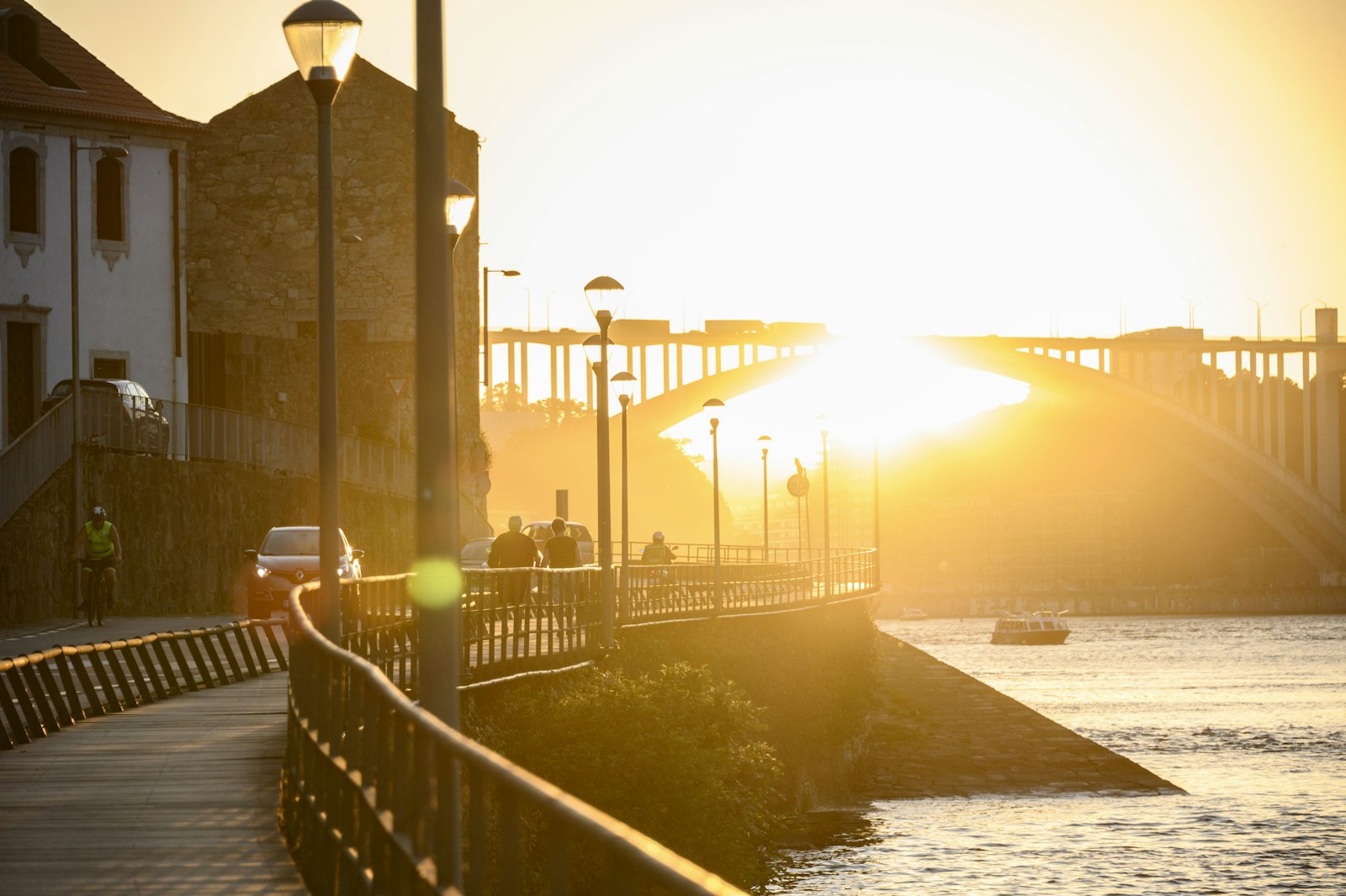 Golden hour light over a river and bridge